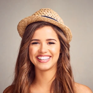 Smiling woman showing bright results after teeth whitening in Glendale